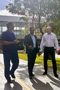FSH Head of Cardiology, Sharad Shetty (left) with FSH Cardiologist, Prof Dwivedi (centre) and SMHS A/Chief Executive Neil Doverty (right) in conversation while walking.