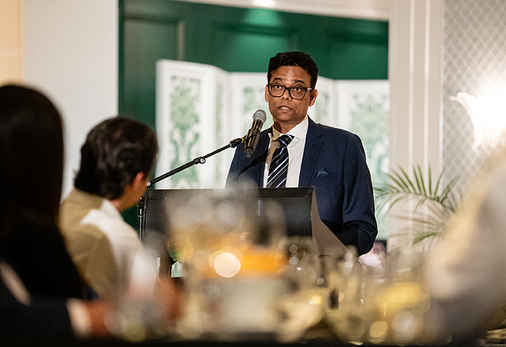 Prof Girish Dwivedi stands at a podium