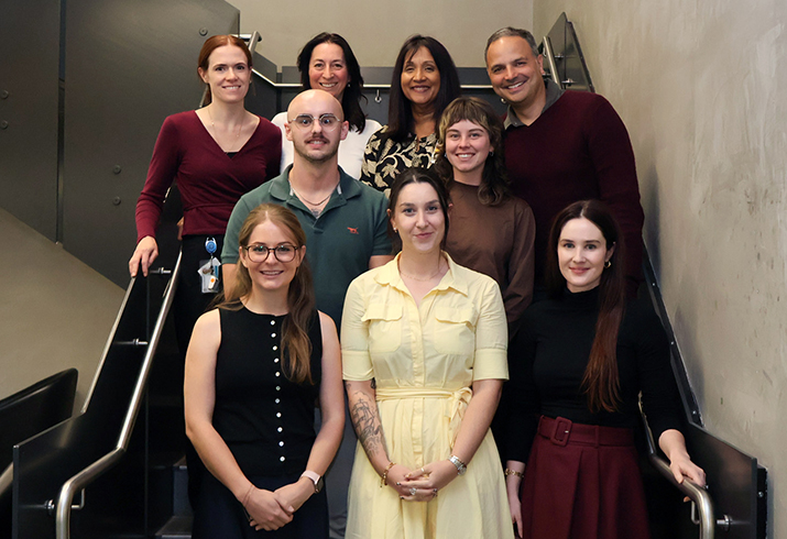 Nine men and women stand on a staircase. Some are the first registrars who will complete their training to become endorsed clinical psychologists as part of the Fiona Stanley Fremantle Hospitals Group