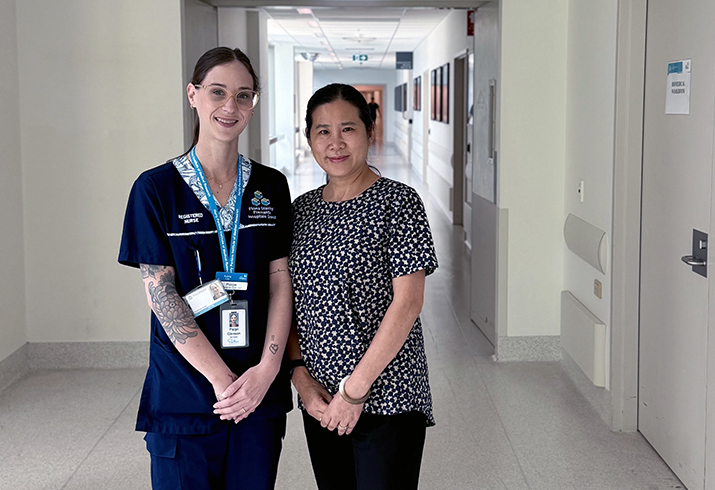 Acting Clinical Nurse and Research Itern Paige Gleason stands in a hospital corridor with Dr Ruth Wei