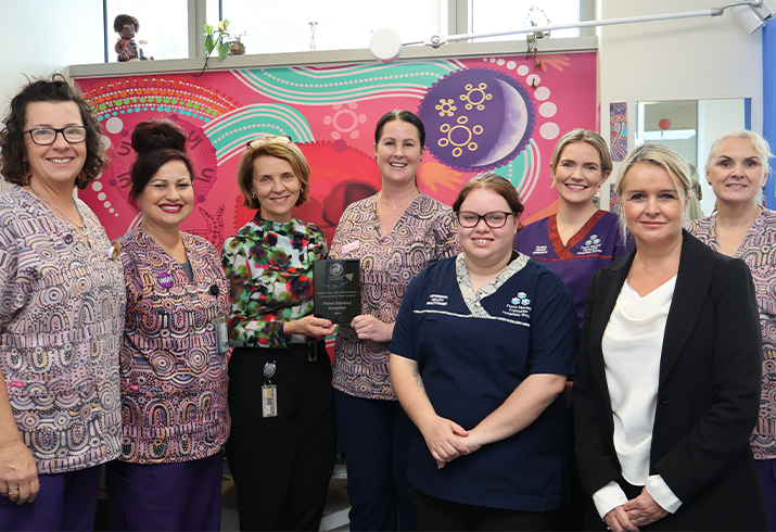 Fiona Stanley Hospital midwives with Aboriginal Health Practitioner Kira and Nurse Director Women and Newborns Hazel, holding the award in the middle. 